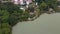 Drone view, evening time flight over Foshan city famous Lakeside downtown park, Qiandeng Lake, China