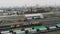 Drone view of freight heavy train with lots of wagons and fule tanks in industrial railway station