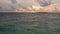 Drone view of Maldives sunset over ocean, panoramic sky with island