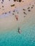 drone view at a men and woman swimming in the blue turqouse colored ocean of Koh Kradan island