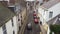 Drone view of a narrow one-way street in a small Scottish town