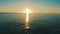 Drone view of ocean, sunset and blue sky with light, nature and peace in calm natural environment. Water, sunrise and