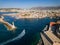 Drone view of the old Venetian lighthouse guarding the entrance to the harbour in the Cretan city of Chania, Greece