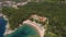 Drone view of Queens Beach with parasols and sun loungers near Milocer Villa