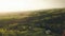 Drone view rain drop falling over asian village. Aerial landscape fruit garden and farming field in asian countryside