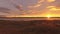 Drone view on a reeds field and estuary at sunset