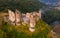 Drone view of remains of Chateau Rocher on cliff, France