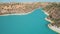 Drone view of reservoir dam on blue lake river in countryside Cyprus rural desert area