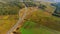 Drone view road junction on country road. Cars moving on road junction