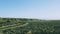 Drone view of a rocky terrain, waterless field, earth dunes, volcanic rock.