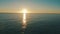 Drone view of sea, sunset and blue sky with light, nature and peace in calm natural environment. Water, sunrise and