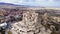 Drone view showcases Uchisar Castle's ancient allure in Cappadocia, Turkey. Uchisar's timeless architecture