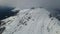 Drone view of the slopes of the Black Pyramid mountain in winter covered in snow