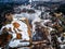 drone view of a small village during a winter flood, showcasing the destruction and devastation of nature