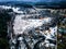 drone view of a small village during a winter flood, showcasing the destruction and devastation of nature