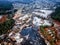 drone view of a small village during a winter flood, showcasing the destruction and devastation of nature