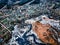 drone view of a small village during a winter flood, showcasing the destruction and devastation of nature