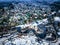 drone view of a small village during a winter flood, showcasing the destruction and devastation of nature