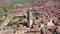 Drone view of Spanish town of El Burgo de Osma in spring overlooking traditional terracotta tiled roofs of residential