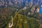Drone view of spectacular mountains and pass road in Zhangjiajie