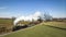 Drone View of a Steam Locomotive Approaching Pulling Passenger Coaches, Blowing White Smoke