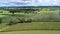 Drone View of a Streamlined Steam Locomotive Traveling Thru Corn Green Fields, Blowing Lots of Smoke