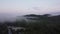 Drone view of sunrise over Lake Squam and mountain range in New Hampshire