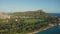 A drone view at sunset of Waikiki Beach and Diamond Head Crater, a famous tourist destination in Honolulu, Oahu, Hawaii