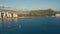 A drone view at sunset of Waikiki Beach and Diamond Head Crater, a famous tourist destination in Honolulu, Oahu, Hawaii