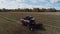 Drone view to harvesting field with working combine harvester