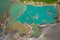 Drone view of the turquoise lake formed as a result of mining waste