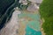 Drone view of the turquoise lake formed as a result of mining waste