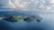 Drone view of two mountains on the shore, yachts sail in the sea, on the horizon an island with a city, cloudy Saint Lucia