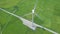 Drone view windmill turbine on green field. Wind power turbine generation on energy station aerial view. Alternative