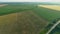 Drone wide shot haystack and harvesting dry grass, aerial hay bales at field