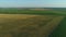 Drone wide shot haystack and harvesting dry grass, aerial hay bales at field