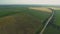 Drone wide shot haystack and harvesting dry grass, aerial hay bales at field