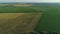 Drone wide shot haystack and harvesting dry grass, aerial hay bales at field