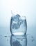 Drop of ice in a glass of water. Pure spring drinking water, drops of water, splash