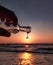 A drop of water getting mixed with the sea at the time of sunset
