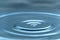 A drop of water hovering in the air before hitting a water surface, which will cause a beautiful splash, close-up photo