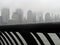 Droplets on handrail and New York city covered in fog in the background
