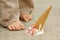 Dropped Ice Cream Cone by Child\'s Feet