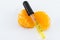 A Dropper of Vitamin C Serum on Orange Wedges