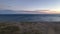 Dropping down on deserted sand dunes and blue ocean waters at sunrise