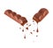 Drops dripping from bar of porous milk chocolate isolated on a white background