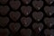 Drops of water on chocolate hearts, baking trays