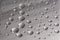 Drops of water on the surface of chrome. Abstract background from drops of water. Selective focus