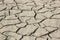 Drought barren cracked soil textured background, global warming