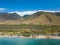 Drove side view of the dry mountains and crystal clear waters of the Lahaina Coast on the island of Maui, Hawaii